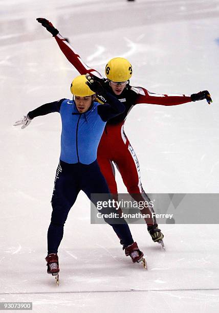 Apolo Anton Ohno of the United States beats Francois Hamelin of Canada to the finish line to winthe 1000m final during the the ISU World Cup Short...