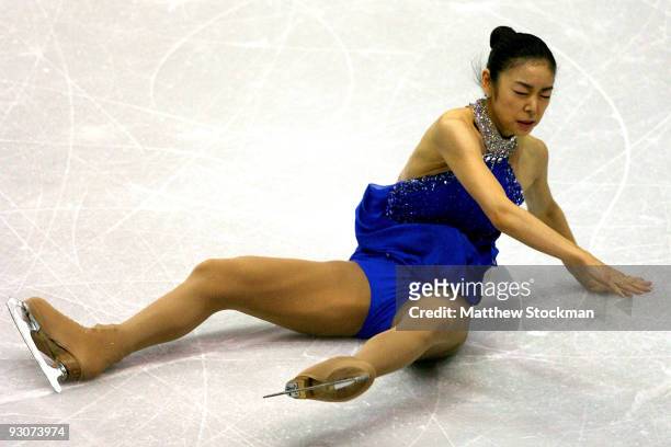 Yu-Na Kim of South Korea falls to the ice in the Free Skate during the Cancer.Net Skate America at Herb Brooks Arena on November 15, 2009 in Lake...