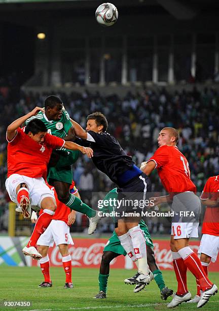 Goalkeeper of Switzerland Benjamin Siegrist saves from the head of Sani Emanuel of Nigeria during the FIFA U17 World Cup Final match between...