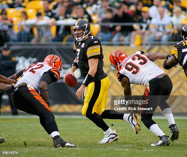 Ben Roethlisberger of the Pittsburgh Steelers is pressured by Frostee Rucker and Michael Johnson of the Cincinnati Bengals at Heinz Field on November...
