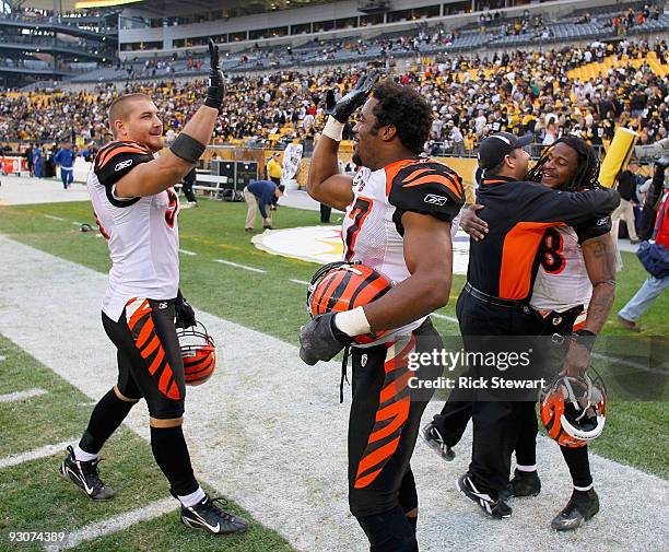 Dan Skuta, Dhani Jones, Bernard Scott and a coach of the Cincinnati Bengals celebrate their win over the Pittsburgh Steelers at Heinz Field on...