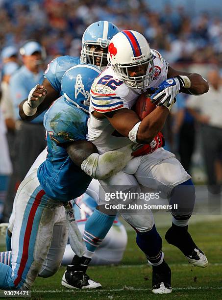 Fred Jackson of the Buffalo Bills is tackled by Keith Bulluck of the Tennessee Titans in their NFL game at LP Field on November 15, 2009 in...