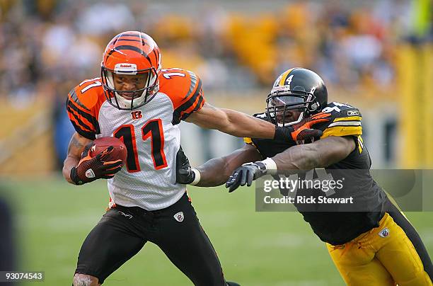 Laveranues Coles of the Cincinnati Bengals stiff arms Lawrence Timmons of the Pittsburgh Steelers at Heinz Field on November 15, 2009 in Pittsburgh,...