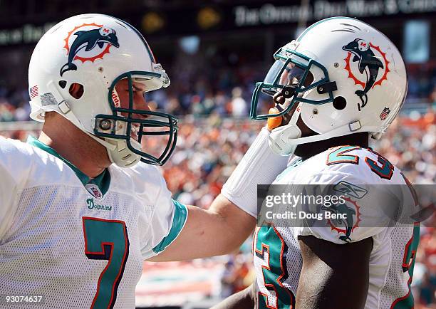 Quarterback Chad Henne and running back Ronnie Brown of the Miami Dolphins celebrate after a long run against the Tampa Bay Buccaneers at Land Shark...