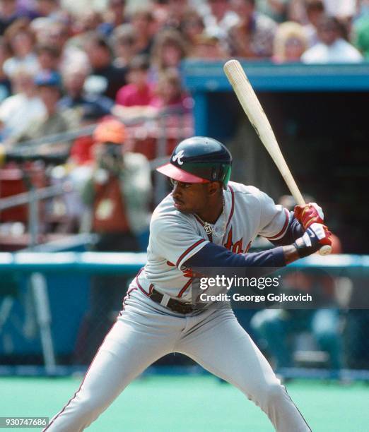 Deion Sanders of the Atlanta Braves bats against the Pittsburgh Pirates during a Major League Baseball game at Three Rivers Stadium circa 1993 in...
