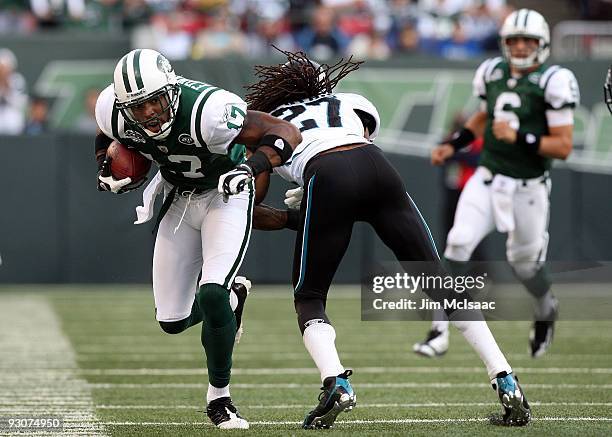 Braylon Edwards of the New York Jets runs the ball against Rashean Mathis of the Jacksonville Jaguars after a reception on November 15, 2009 at...