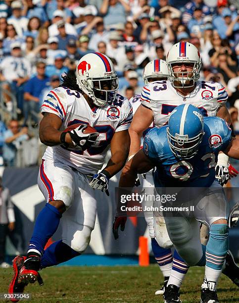 Marshawn Lynch of the Buffalo Bills fights to break free from Kyle Vanden Bosch of the Tennessee Titans in their NFL game at LP Field on November 15,...