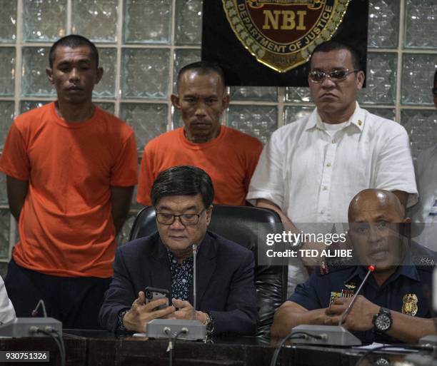 Philippine National Police Chief Director General, Ronald Dela Rosa speaks, while Justice Secretary Vitaliano Aguirre listens during the presentation...