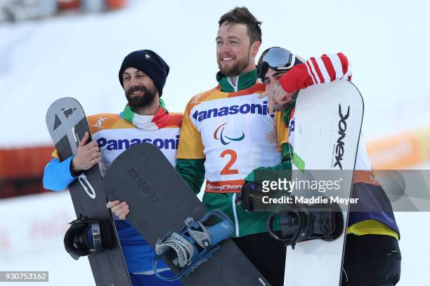 Simon Patmore of Australia celebrates winning the Gold medal with Silver medallist Manuel Pozzerle of Italy and Bronze medallist Mike Minor of USA in...
