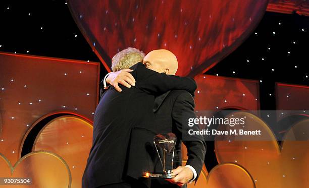 Sir Ian McKellen receives the The Bernard Delfont Award for Outstanding Contribution to Showbusiness from Patrick Stewart during the Variety Club...