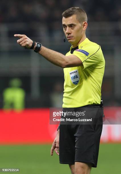 Referee Clement Turpin gestures during UEFA Europa League Round of 16 match between AC Milan and Arsenal at the San Siro on March 8, 2018 in Milan,...