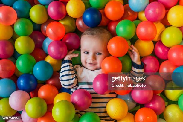 little boys just want to have fun - ball pit stock pictures, royalty-free photos & images