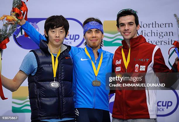 Apolo Anton Ohno , gold, South Korea's Lee Jung-Su, , silver, and Canada's Francois Hamelin celebrate on the podium of the men's 1,000m final at the...