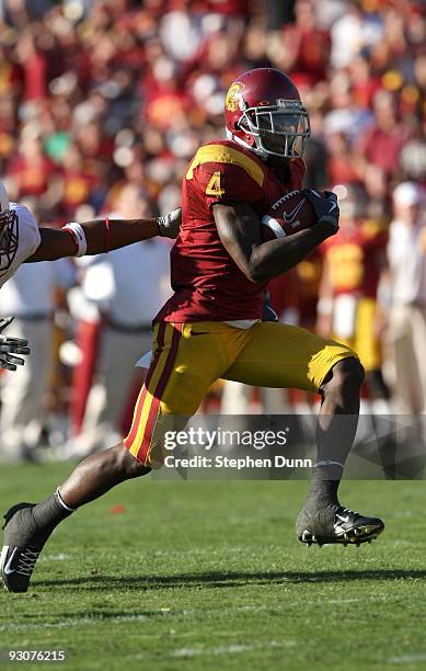 Running back Joe McKnight of the USC Trojans breaks away on a 28 yard touchdown run against the Stanford Cardinal on November 14, 2009 at the Los...