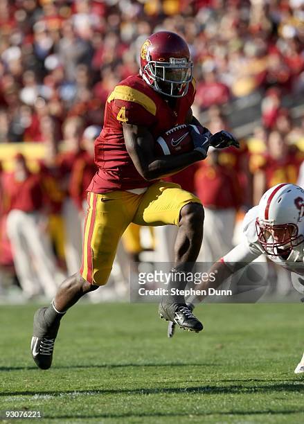 Running back Joe McKnight of the USC Trojans breaks away on a 28 yard touchdown run against the Stanford Cardinal on November 14, 2009 at the Los...