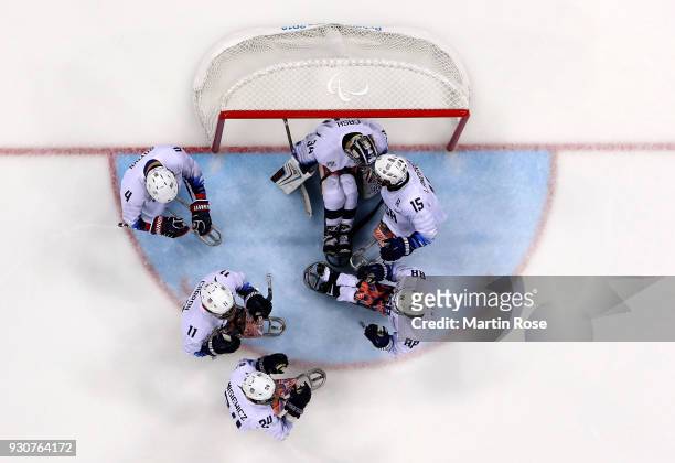 Steve Cash, goaltender of United States celebrate with his team mates after the Ice Hockey Preliminary Round - Group B game between United States and...