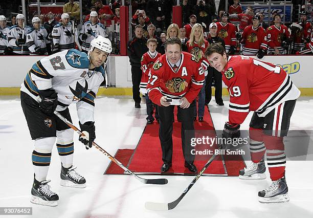 Former Chicago Blackhawks player Jeremy Roenick drops the puck with Jonathan Toews of the Blackhawks and Manny Malhotra of the San Jose Sharks on...