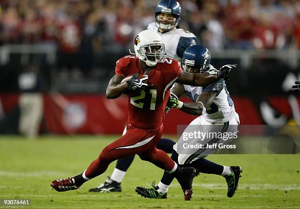 Antrel Rolle of the Arizona Cardinals is pursued by Deion Branch of the Seattle Seahawks after making an interception in the second half at...