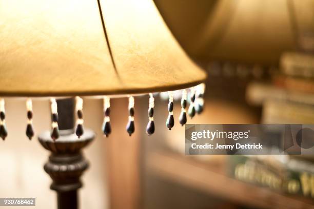 close-up of illuminated lamp - lampenschirm stock-fotos und bilder