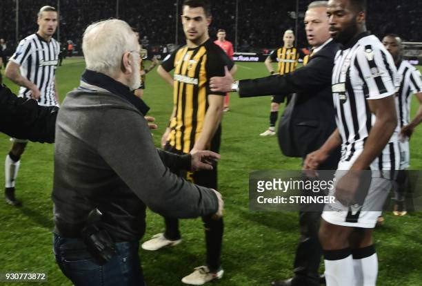 S Greek-Russian president Ivan Savvidis takes to the pitch carrying a handgun in his waistband , after the referee refused a last minute goal on...