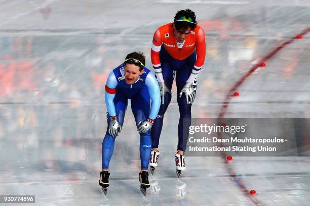 Sverre Lunde Pedersen of Norway and Patrick Roest of the Netherlands speak after they compete in the 1500m Mens race during the World Allround Speed...