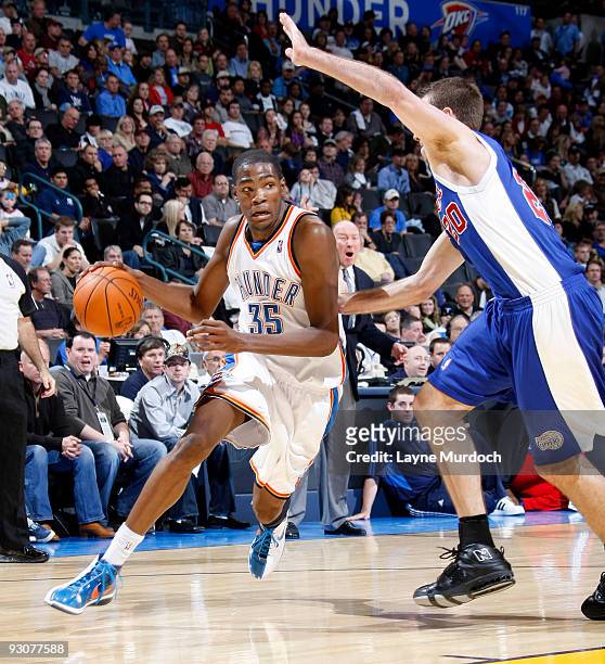 Kevin Durant of the Oklahoma City Thunder goes to the basket against Steve Novak of the Los Angeles Clippers on November 15, 2009 at the Ford Center...