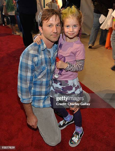 Actor Breckin Meyer and daughter Caitlin attend P.S. Arts Express Yourself 2009 at Barker Hangar at the Santa Monica Airport on November 15, 2009 in...