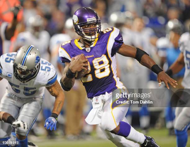 Adrian Peterson of the Minnesota Vikings runs with the ball during an NFL game against the Detroit Lions at the Mall of America Field at Hubert H....
