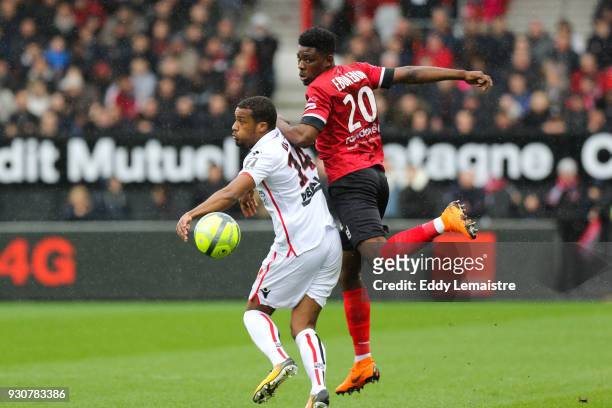 Alassane Plea of Nice and Felix Eboa of Guingamp during the Ligue 1 match between EA Guingamp and OGC Nice at Stade du Roudourou on March 11, 2018 in...