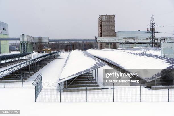 Snow covers solar panels in the solar park operated by Solar Chernobyl SPP in Chernobyl, Ukraine, on Wednesday, Feb. 28, 2018. Solar Chernobyl SPP, a...