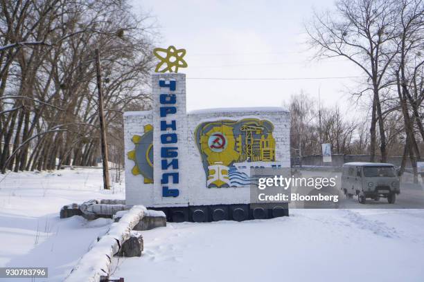 Soviet era mural marks the entrance to the city of Chernobyl, Ukraine, on Wednesday, Feb. 28, 2018. Solar Chernobyl SPP, a partnership between Rodina...