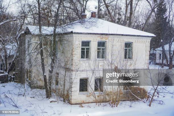Residential house stands abandoned in Chernobyl, Ukraine, on Wednesday, Feb. 28, 2018. Solar Chernobyl SPP, a partnership between Rodina Energy Group...