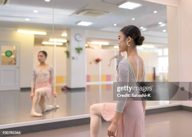 beautiful ballet dancer practicing in bright ballet studio - ballet studio stock pictures, royalty-free photos & images