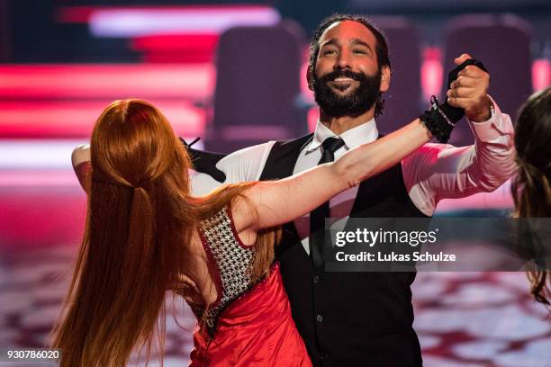 Massimo Sinato and Barbara Meier perform on stage during the pre-show 'Wer tanzt mit wem? Die grosse Kennenlernshow' of the television competition...