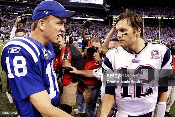 Quarterback Peyton Manning of the Indianapolis Colts greets Tom Brady of the New England Patriots after the game at Lucas Oil Stadium on November 15,...