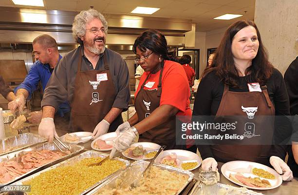Actor Harold Ramis along with other volunteers prepares meals during the fifth annual Chicago Bulls Luol Deng Thanksgiving Dinner on November 15 at...