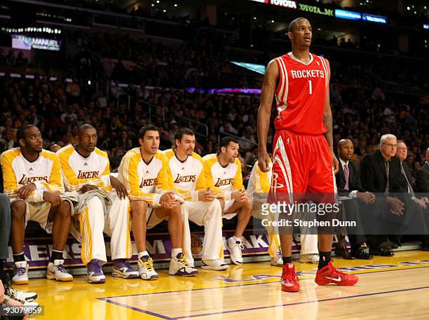 Trevor Ariza of the Houston Rockets stands next to his former teammates on the Los Angeles Lakers bench on November 15, 2009 at Staples Center in Los...