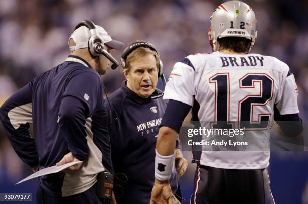 Quarterback Tom Brady of the New England Patriots speaks to head coach Bill Belichick in the fourth quarter of the game against the Indianapolis...