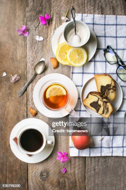 overhead view of tea break food and drink table top image. - cup of tea from above fotografías e imágenes de stock