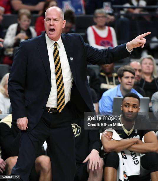 Head coach Tad Boyle of the Colorado Buffaloes yells to his players during a quarterfinal game of the Pac-12 basketball tournament against the...