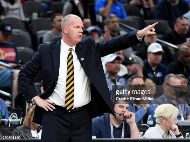 Head coach Tad Boyle of the Colorado Buffaloes signals his players during a quarterfinal game of the Pac-12 basketball tournament against the Arizona...