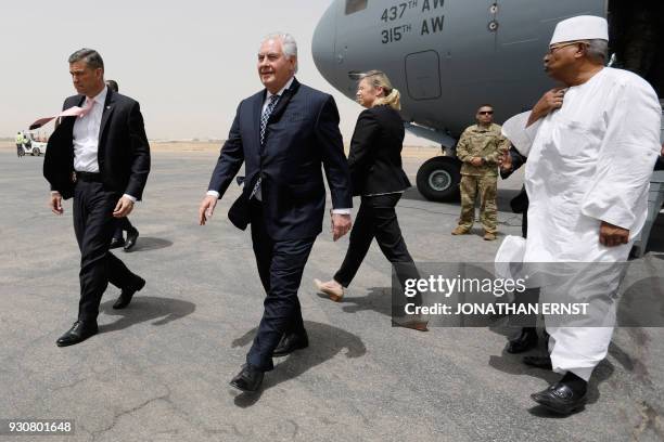 Secretary of State Rex Tillerson arrives at N'Djamena's international airport for an official state visit on March 12, 2018. / AFP PHOTO / POOL /...