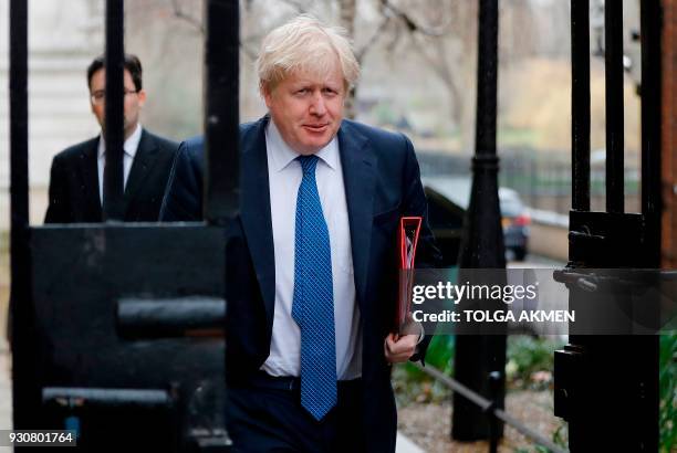 Britain's Foreign Secretary Boris Johnson arrives in Downing Street in central London on March 12 ahead of a meeting of the National Security...