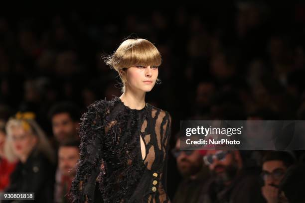 Model walks the catwalk during the fashion designer Luis Carvalho Fall / Winter 2018 - 2019 collection runway show at the 50 edition of Lisboa...