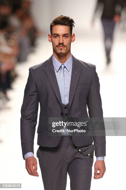 Model walks the catwalk during the fashion designer Nuno Gama Fall / Winter 2018 - 2019 collection runway show at the 50 edition of Lisboa Fashion...