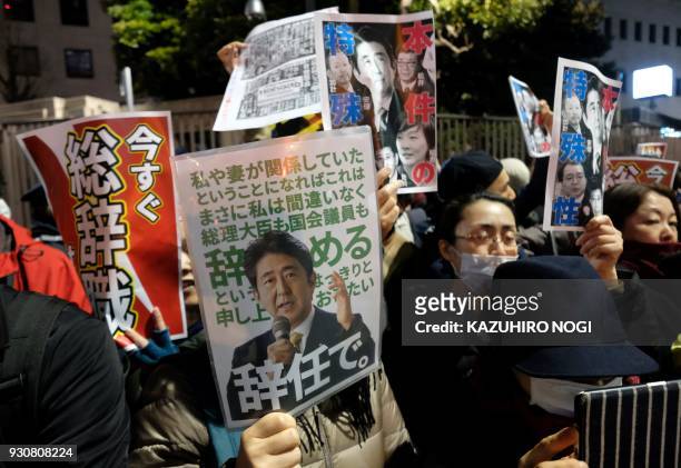 Protesters stage an anti-Abe demonstration near the prime minister's official residence in Tokyo on March 12, 2018. Japan's finance ministry admitted...