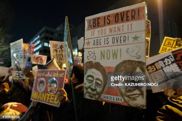 Protesters stage an anti-Abe demonstration near the prime minister's official residence in Tokyo on March 12, 2018. Japan's finance ministry admitted...