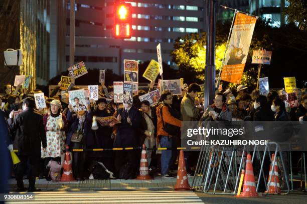 Protesters stage an anti-Abe demonstration near the prime minister's official residence in Tokyo on March 12, 2018. Japan's finance ministry admitted...