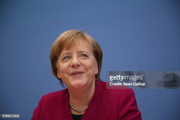 German Chancellor and Chairwoman of the German Christian Democrats Angela Merkel arrives with Acting Chairman of the German Social Democrats Olaf...