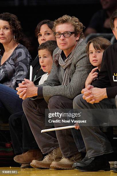 Rebecca Rigg, Harry Friday, Simon Baker and Claude Blue attend a game between the Houston Rockets and the Los Angeles Lakers at Staples Center on...